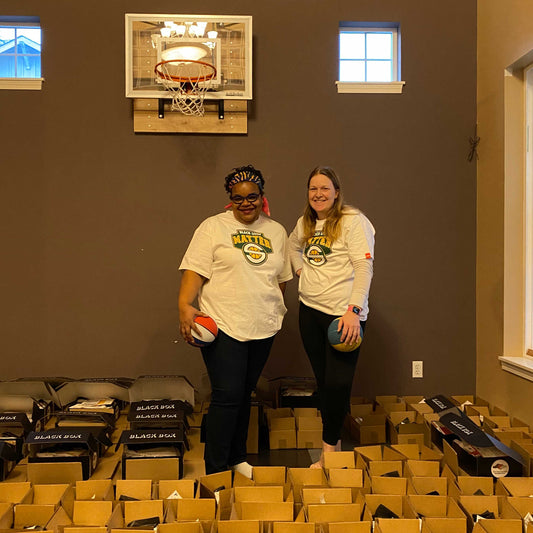 Kesha Rodgers and Sara So in Sara's living room-turned-remote learning basketball court-turned production area